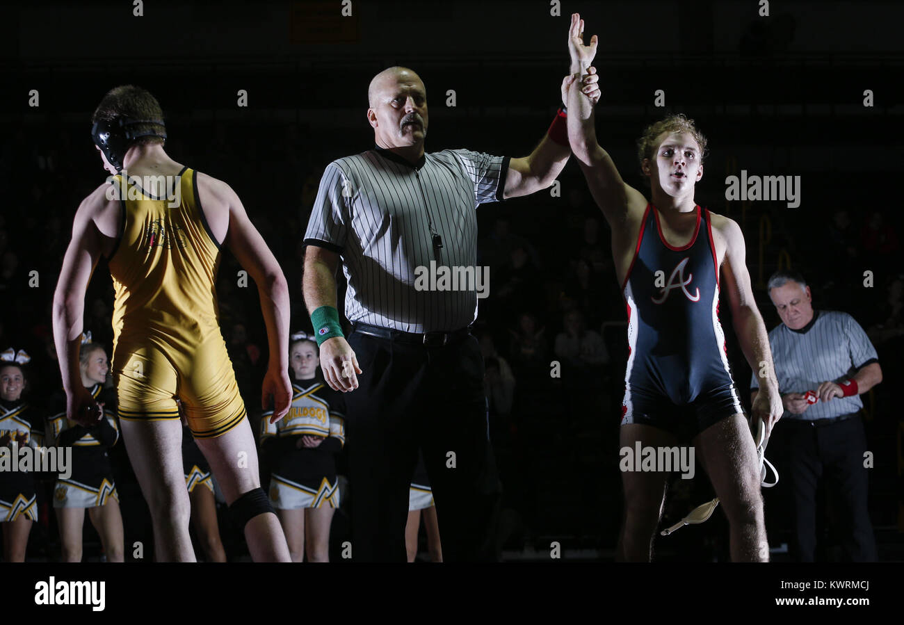 Bettendorf, Iowa, USA. 11th Jan, 2017. Assumption junior Matt Robertson is declared the winner of this 132 weight match against Bettendorf sophomore Will Jefferson during their dual at Bettendorf High School on Wednesday, January 11, 2017. Bettendorf won the dual 36-35 on criteria after a tie. Credit: Andy Abeyta/Quad-City Times/ZUMA Wire/Alamy Live News Stock Photo