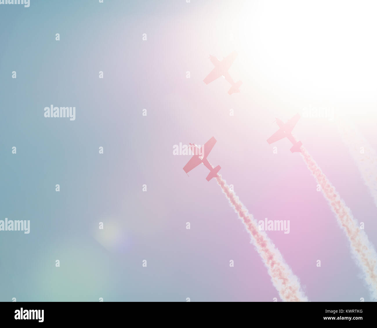 Synchronous flight in beams of the sun  sparkling planes on air celebratory parade Stock Photo