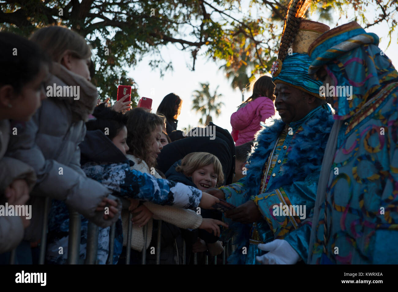 Barcelona, Spain. 5th Dec, 2018. Thousands of children await the arrival of the wise men to give them their wish letters in hand. The parade symbolizes the coming of the Magi to Bethlehem following the birth of Jesus, marked in Spain and many Latin American countries Epiphany is the day when gifts are exchanged. Credit: Charlie Perez/Alamy Live News Stock Photo