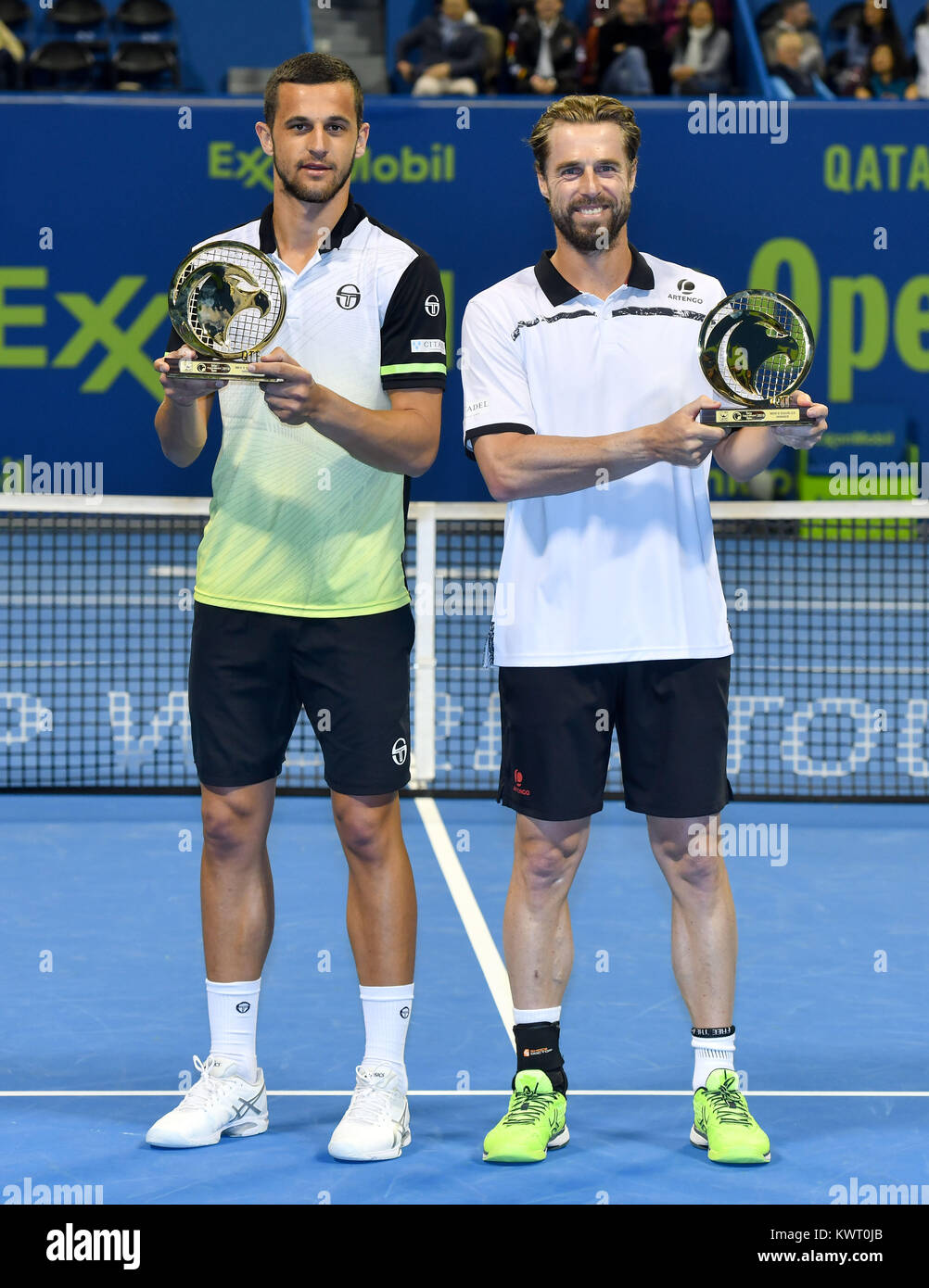 Doha, Qatar. 5th Jan, 2018. Mate Pavic (L) of Croatia and Oliver Marach of  Austria pose with the trophies after winning the ATP Qatar Open Tennis  tournament doubles final against Jamie Murray