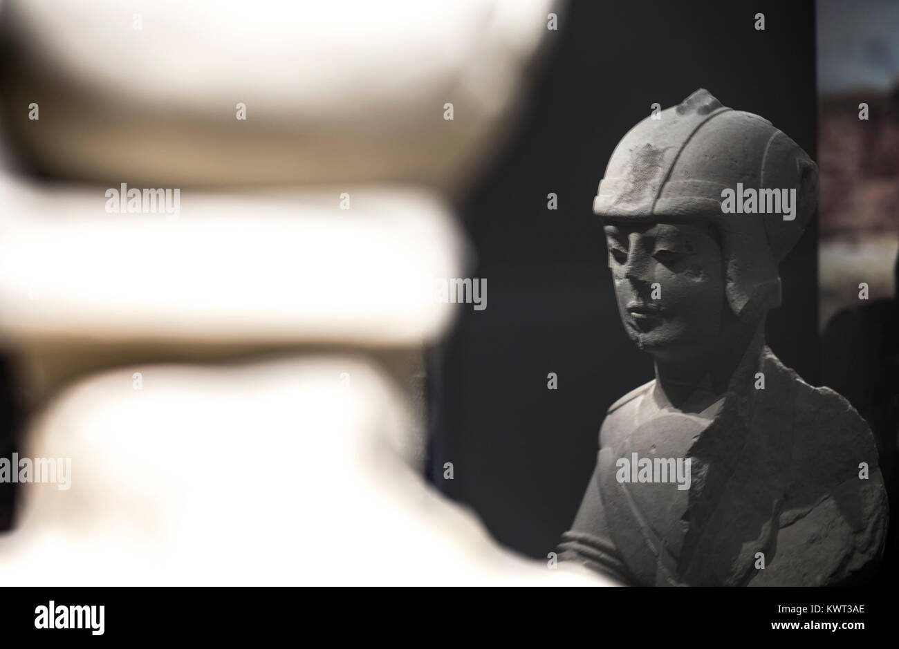 Jaen, Spain - December 29th, 2017: Warrior with double armour at Iberian Museum of Jaen. Back and front on glass reflections Stock Photo