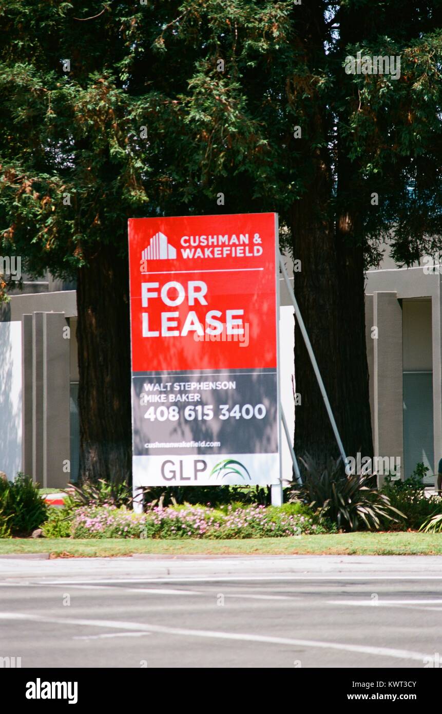 Real estate sign from Cushman and Wakefield on a commercial building for lease in the Silicon Valley, Santa Clara, California, August 17, 2017. Real estate prices in Silicon Valley are among the highest in the United States. Stock Photo