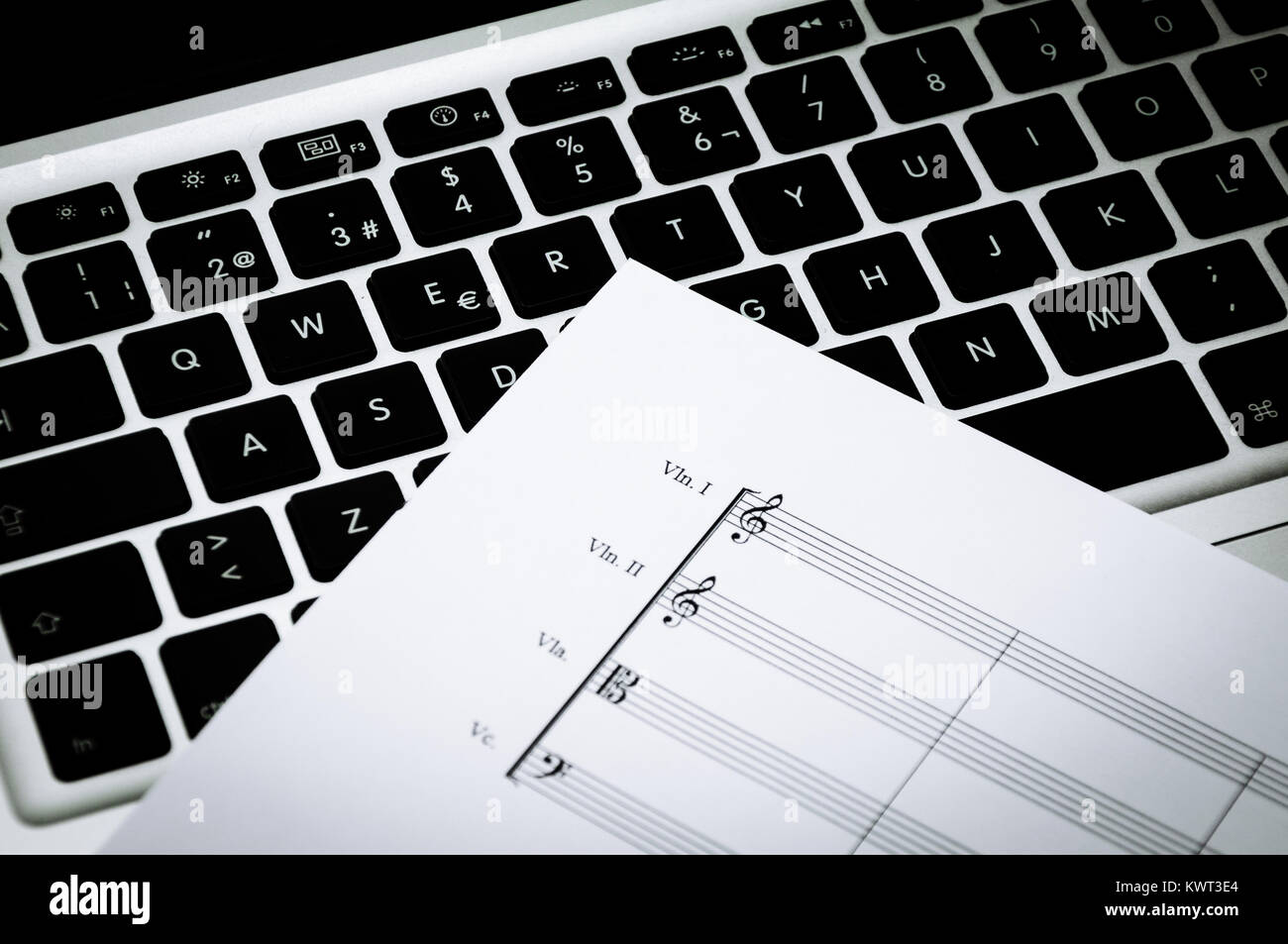 Music paper for strings instruments on a laptop Stock Photo