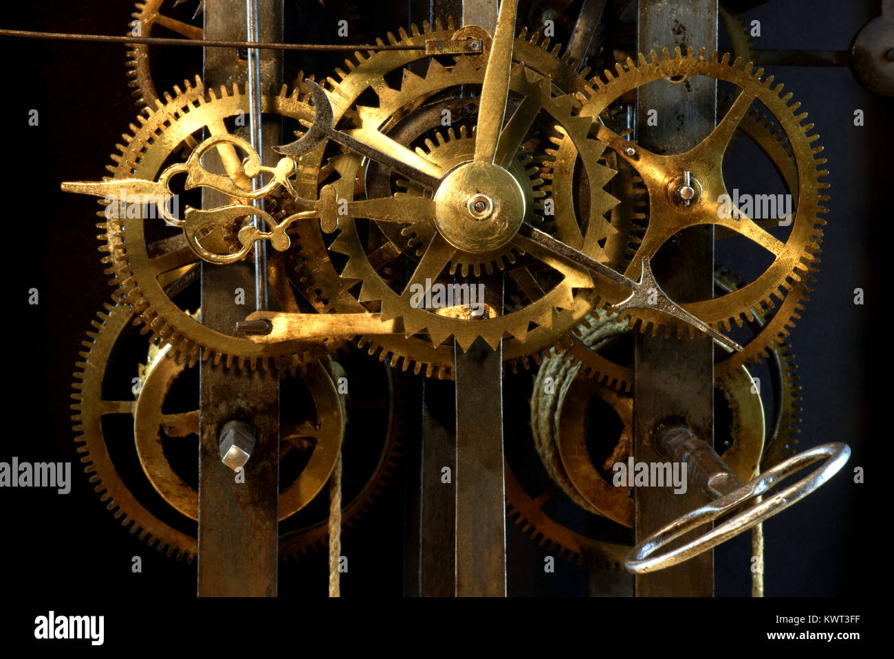 Close up of the gears in a old clockwork in front of black background ...