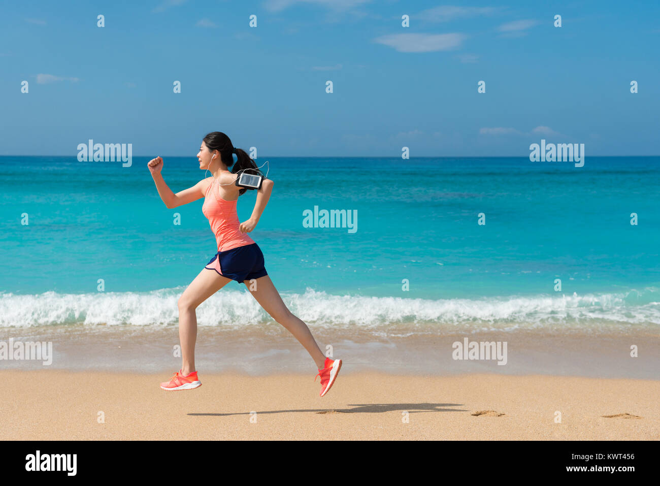 side view photo of beautiful young athletic woman running workout on