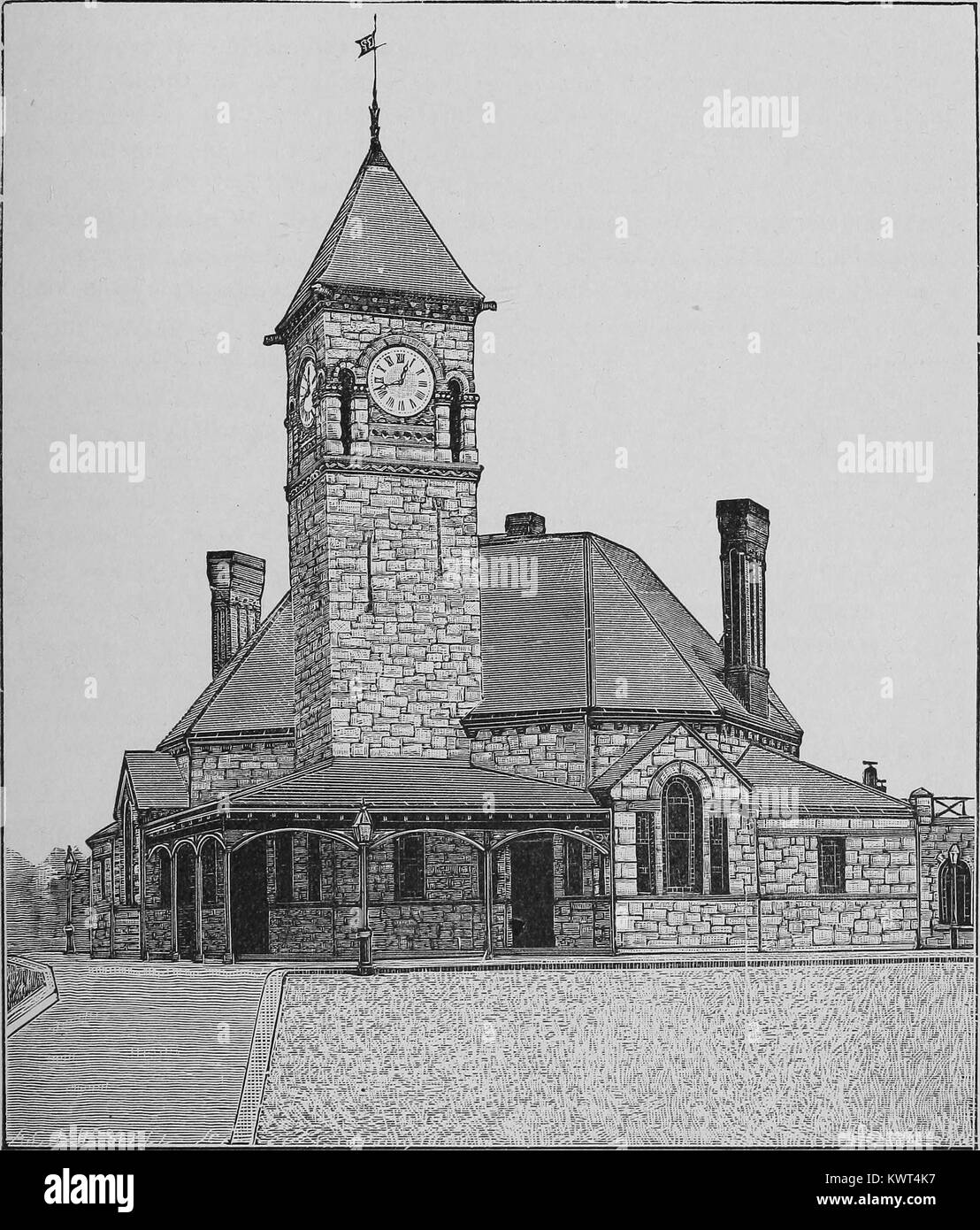 Engraved image of Dedham Station, a railroad station with a clock tower in Dedham, Massachusetts, 1893. Courtesy Internet Archive. Stock Photo