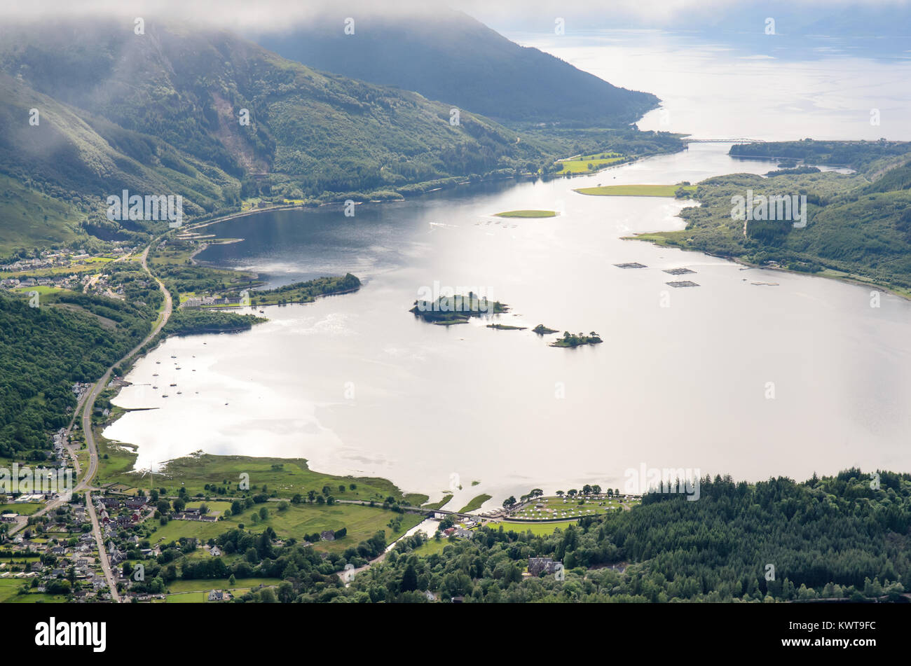 Mountains rise from the shores of Loch Leven sea loch in the West Highlands of Scotland, as seen from the summit of Pap of Glencoe. Stock Photo