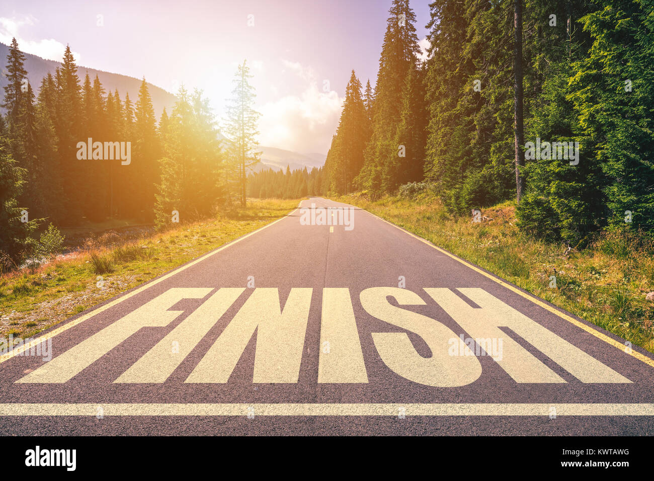 Asphalt road with finish line message Stock Photo Alamy