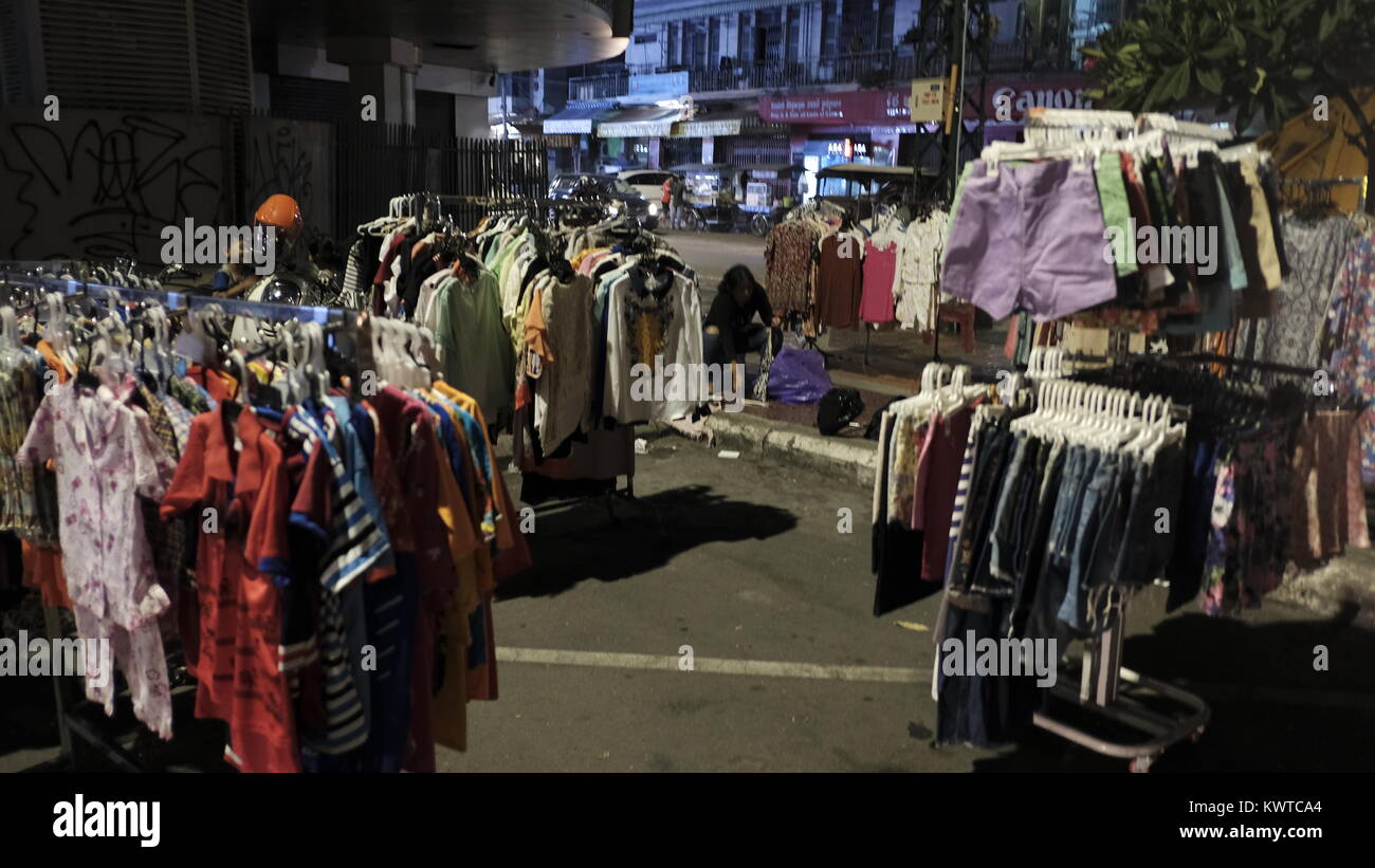 clothes business for sale at open air night market business in Phnom Penh Cambodia southeast Asia point of interest tourist attraction street faire Stock Photo