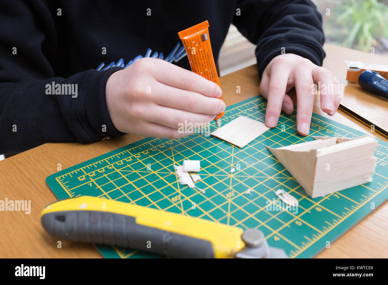 Boy making balsa wood model Stock Photo