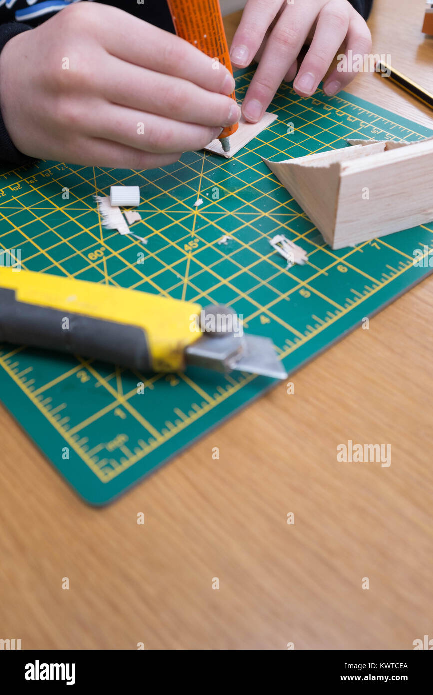 Boy making balsa wood model Stock Photo