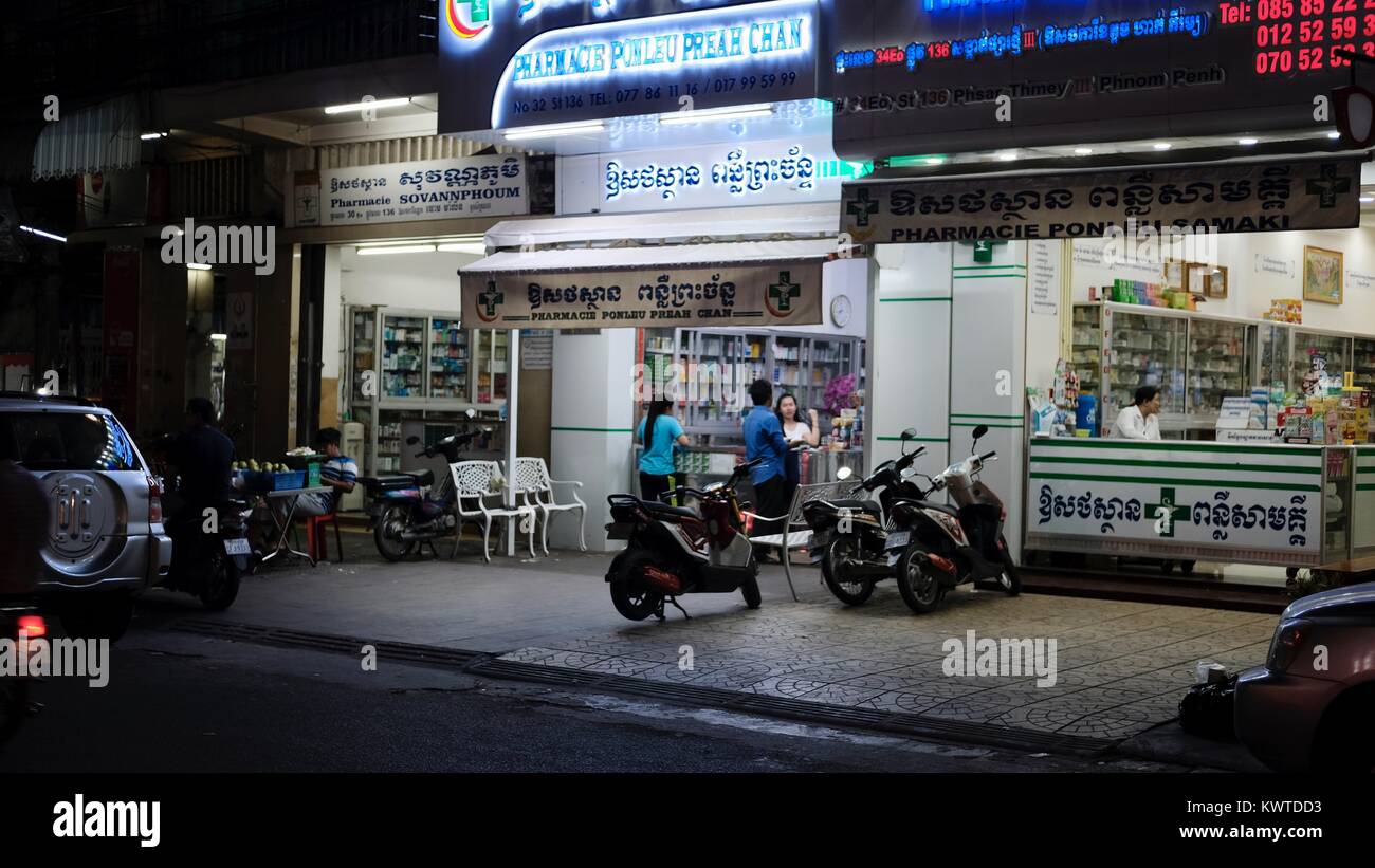 Medicine Pill Sellers on Rue Pharmacie or Pharmacy Row 136 Street and intersection of Pasteur Street 51 Phnom Penh Cambodia at Night Stock Photo
