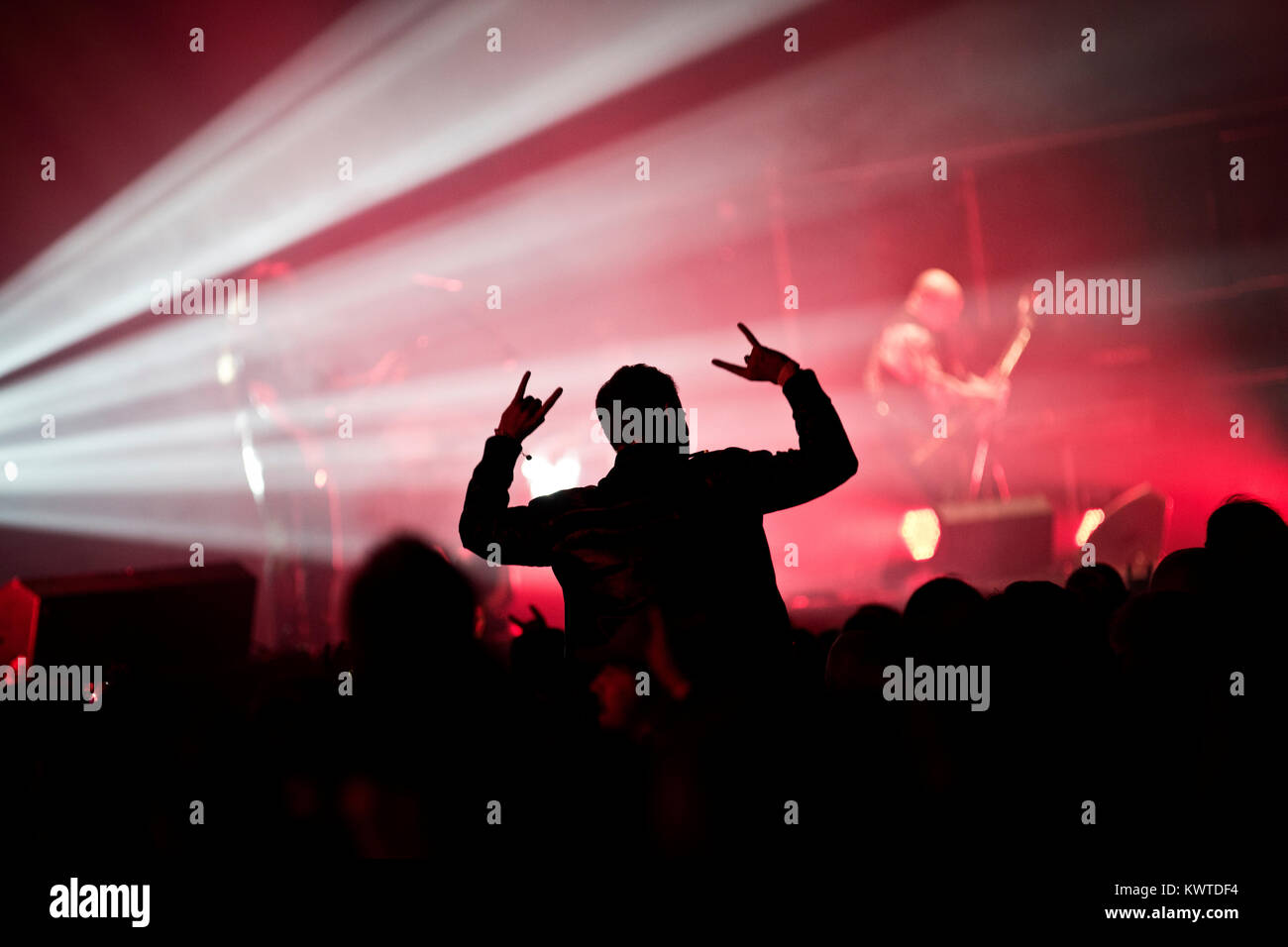 A music fans i sitting on the shoulder of another guy amoun the concert  crowd at a heavy metal festival. Denmark 2012 Stock Photo - Alamy