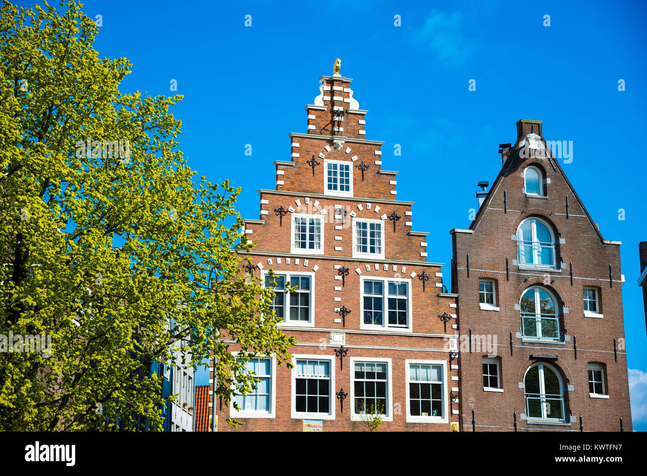 Amsterdam, Netherlands - April 19, 2017: House architecture in Amsterdam. Traditional old dutch buildings Stock Photo