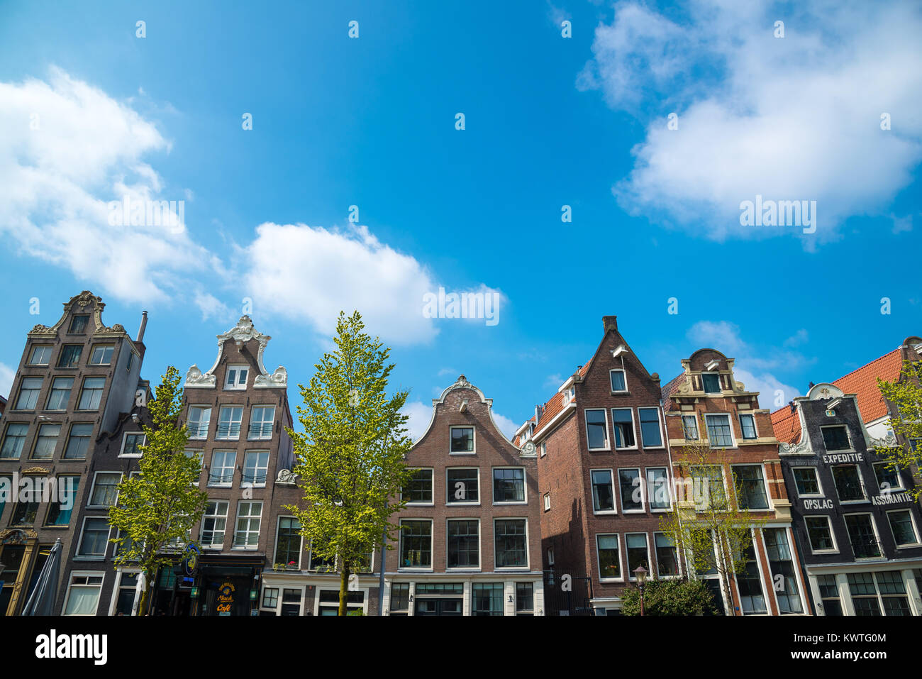 Amsterdam, Netherlands - April 20, 2017: Traditional dutch medieval buildings, beautiful architecture in Amsterdam Stock Photo