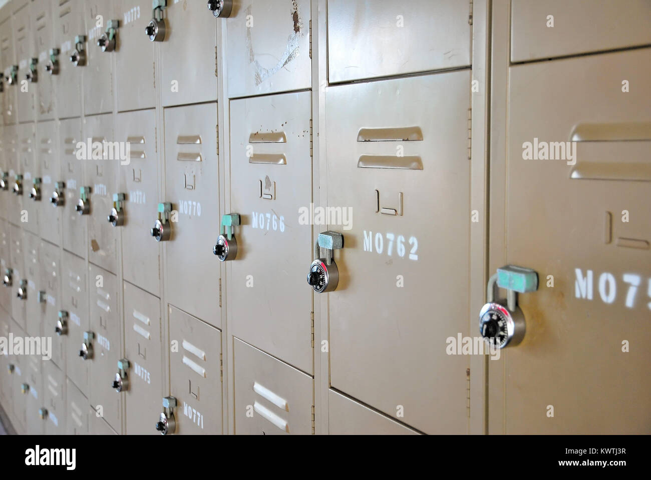 Old, rusty, metal lockers with locks. Represents concepts such as ...