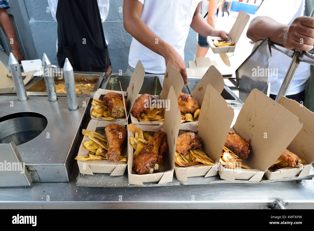 Chicken with chips lunch box sold on stalls, on city streets in Cuba