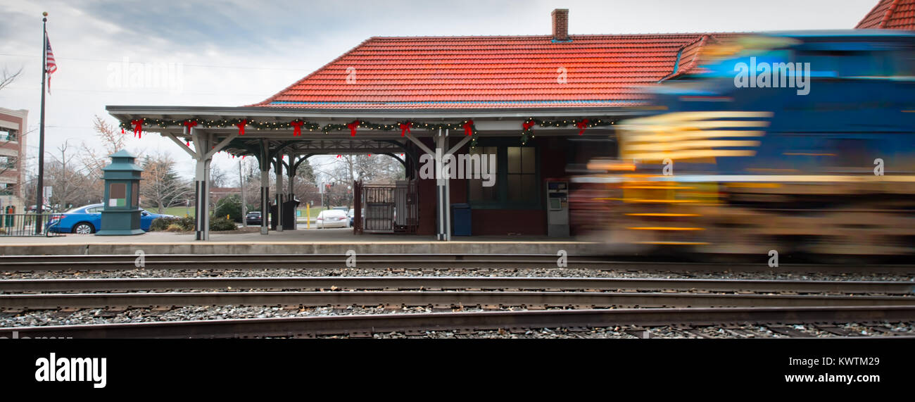 A train leaving the Manassas, Virginia station for Washington, DC that's been recently decorated for Christmas. Stock Photo