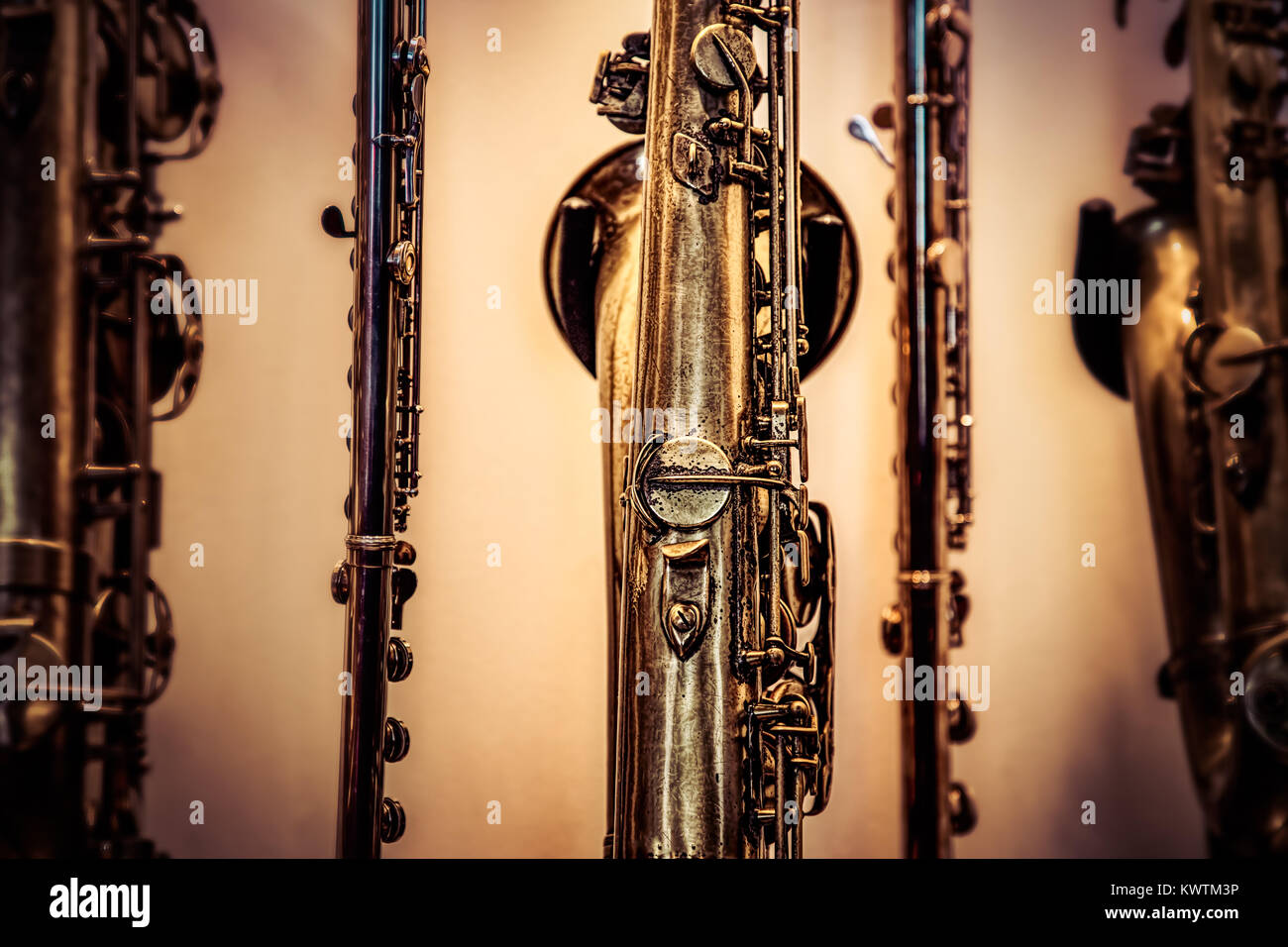 A collection of woodwind instruments including a flute and saxophones. Stock Photo