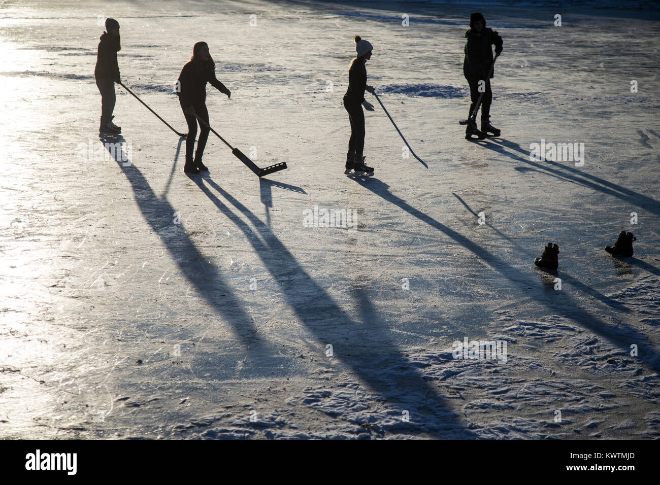 Ice hockey players on a pond in late afternoon Stock Photo Alamy