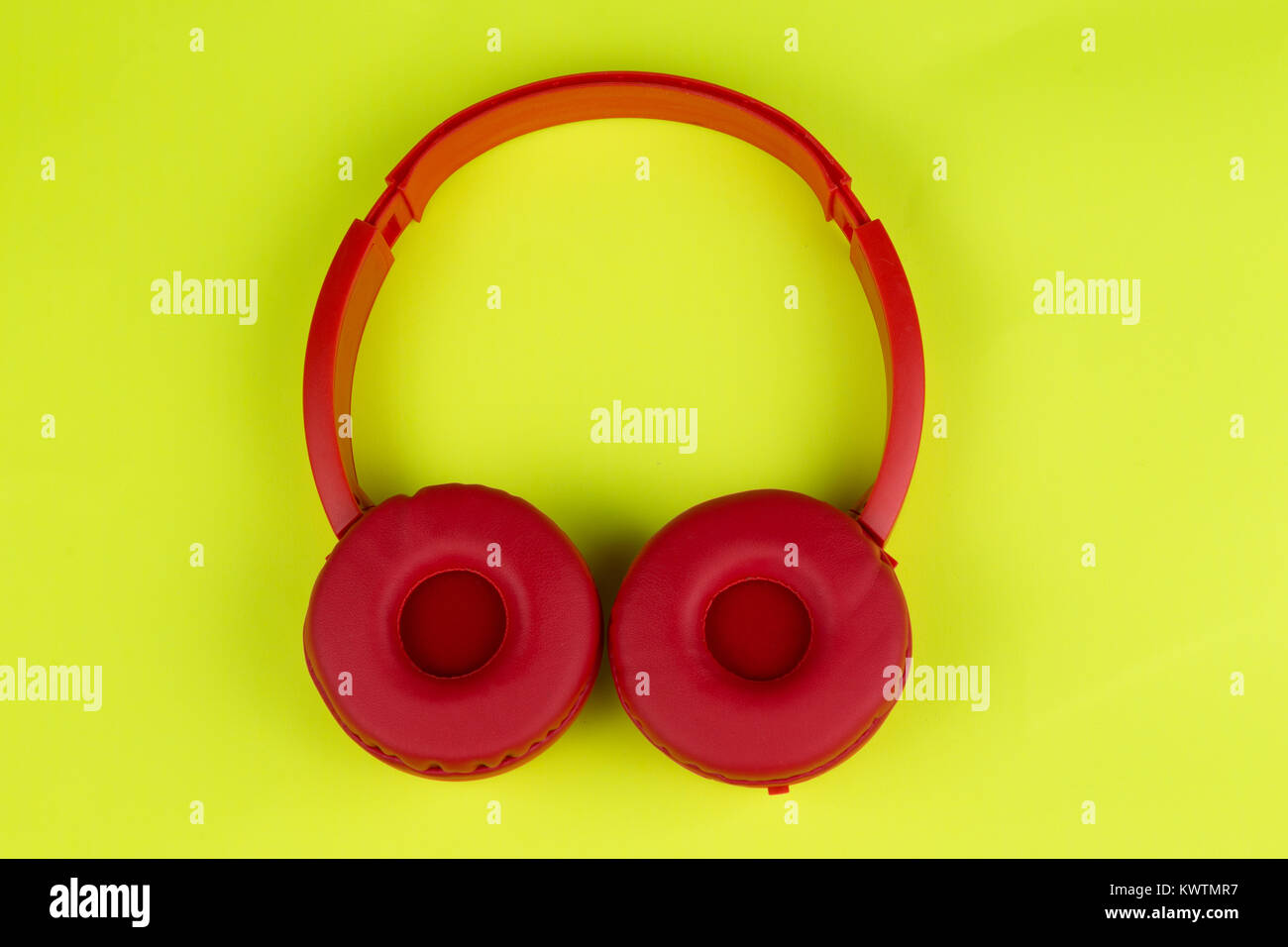 A colorful top view of a tangerine red headphones Stock Photo