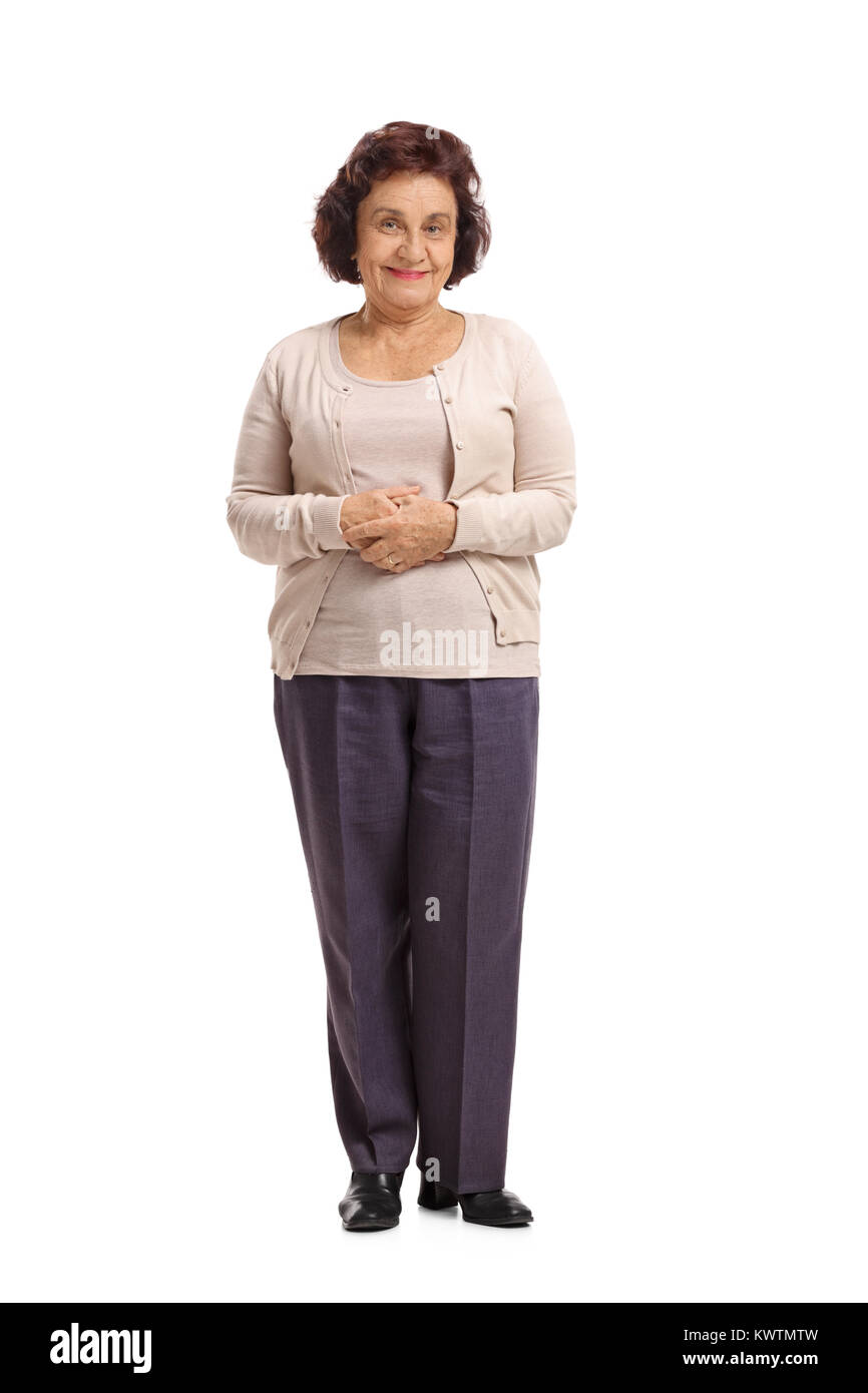 Full length portrait of an elderly woman looking at the camera and smiling isolated on white background Stock Photo