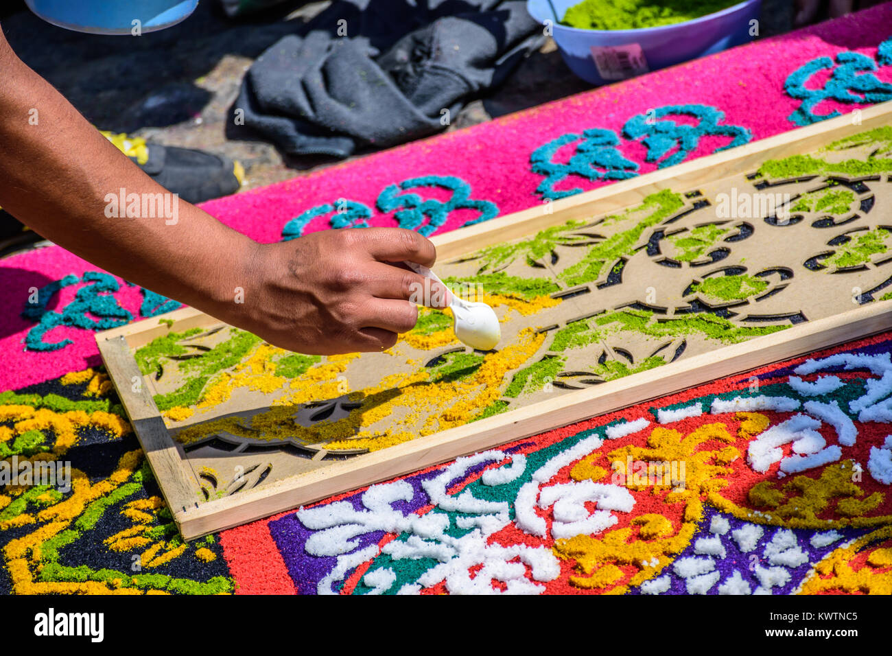 Antigua, Guatemala -  March 6, 2016: Local decorates Lent procession carpet in town with famous Holy Week celebrations Stock Photo