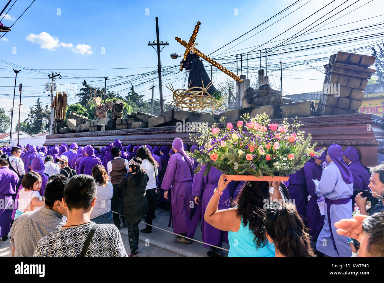 Antigua, Guatemala -  March 19, 2017: Lent procession walks through streets in town with most famous Holy Week celebrations in Latin America Stock Photo