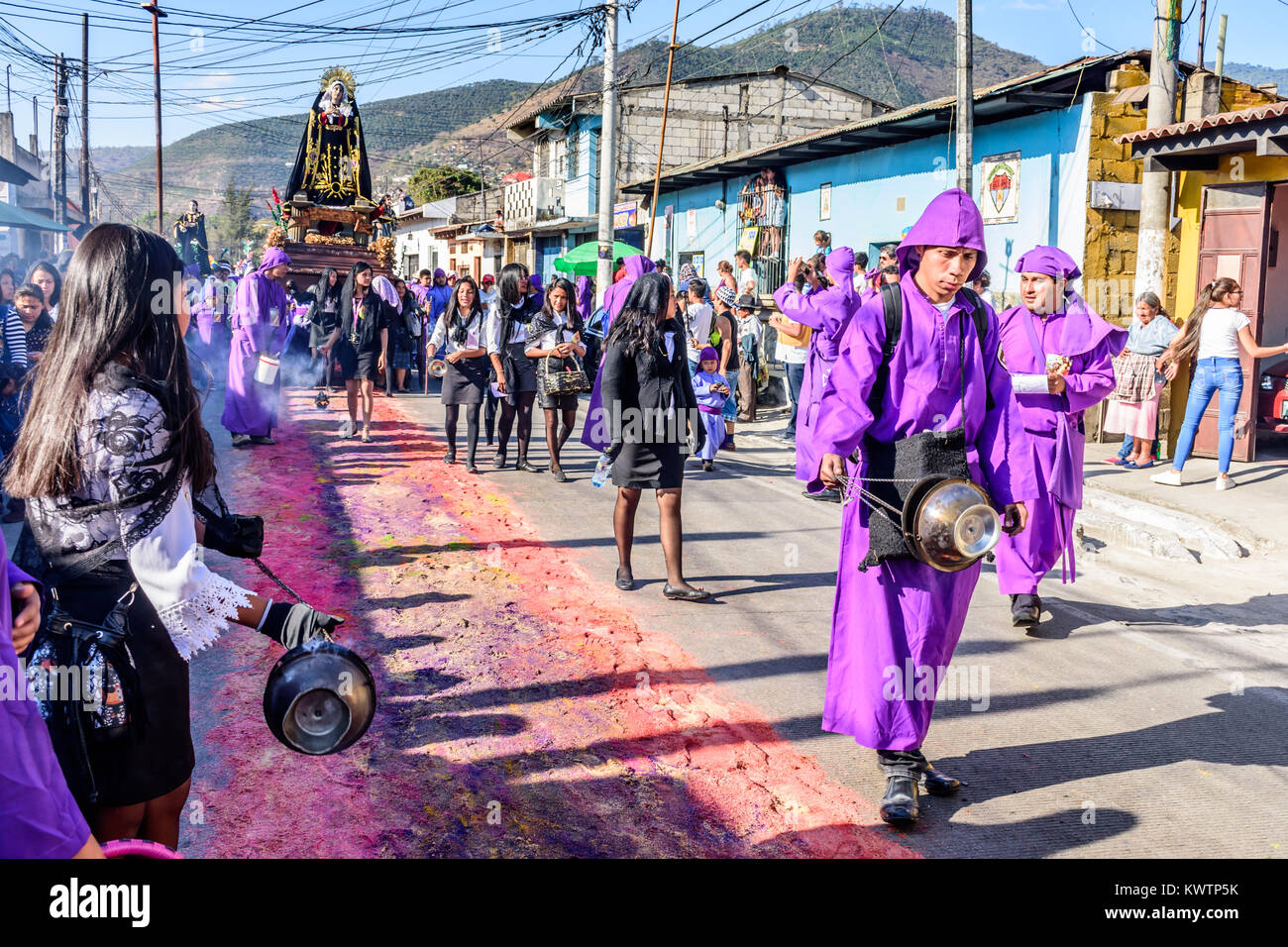 Antigua, Guatemala -  March 19, 2017: Lent procession walks over handmade carpets in town with most famous Holy Week celebrations in Latin America Stock Photo