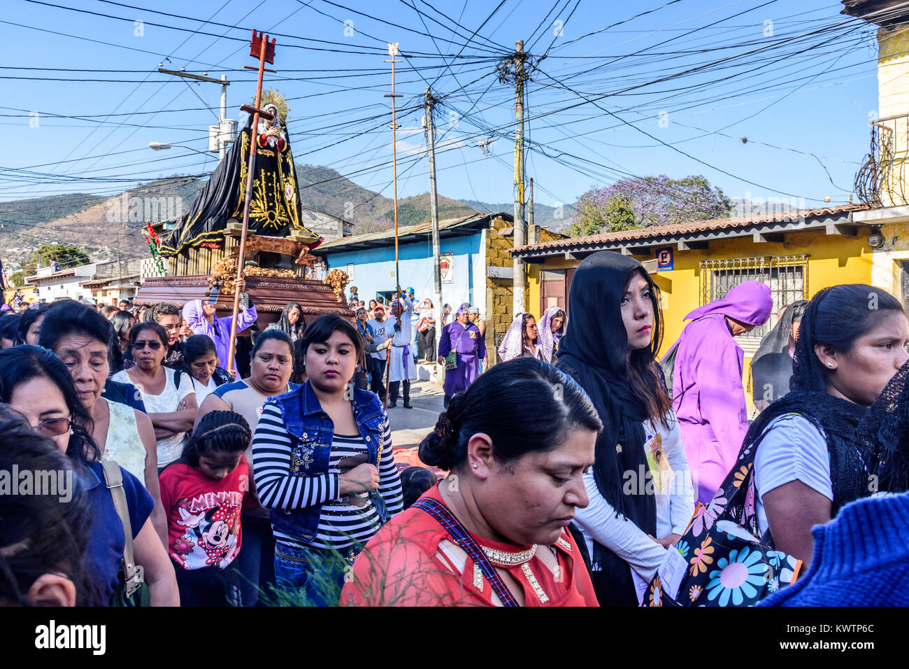 Antigua, Guatemala -  March 19, 2017: Procession with Virgin Mary passes during Lent in town with most famous Holy Week celebrations in Latin America Stock Photo