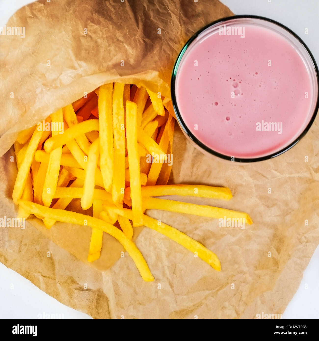 French fries and sweet strawberry milkshake Stock Photo