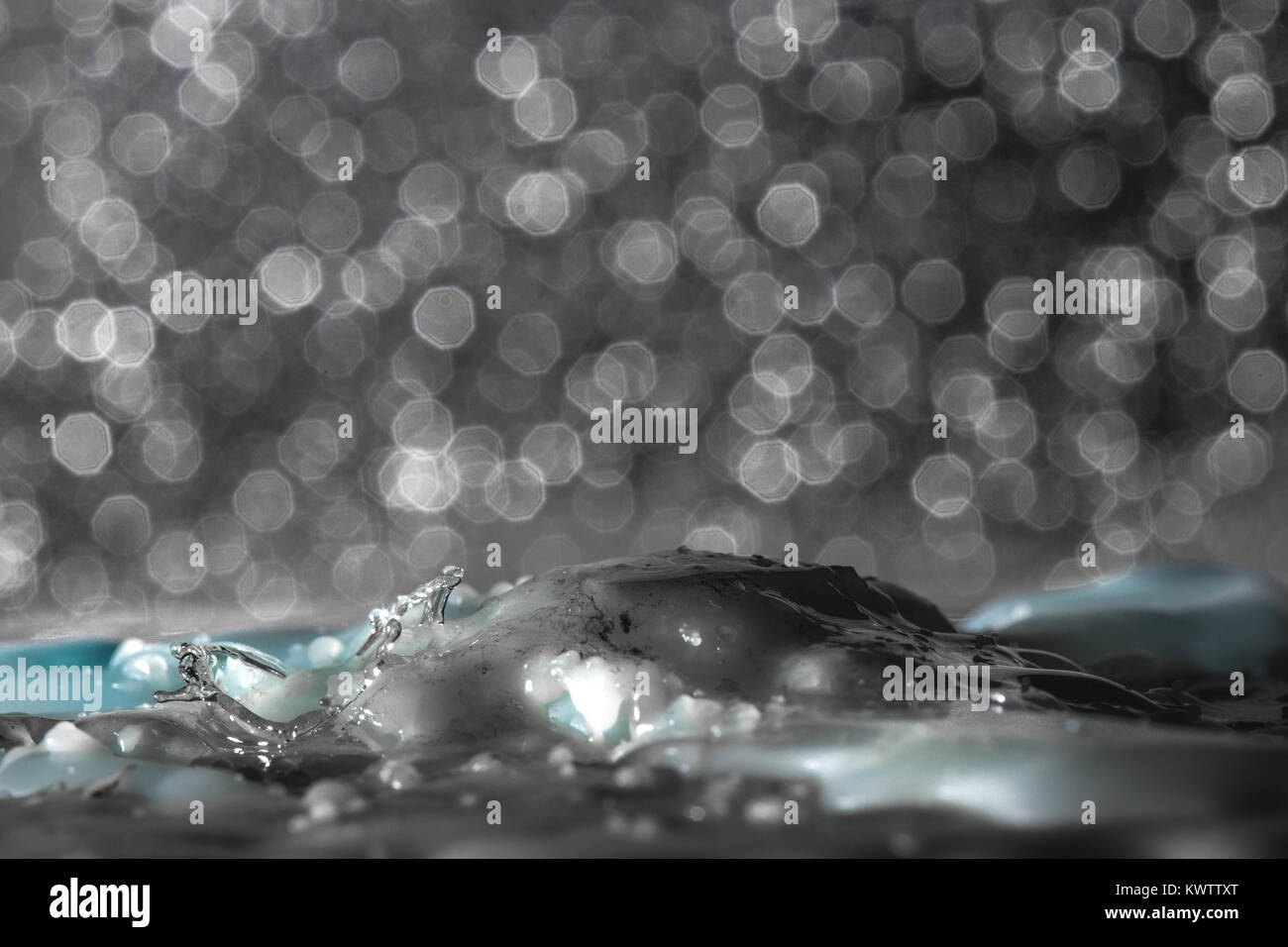 Falling drops or streams of wax on melted wax Stock Photo - Alamy