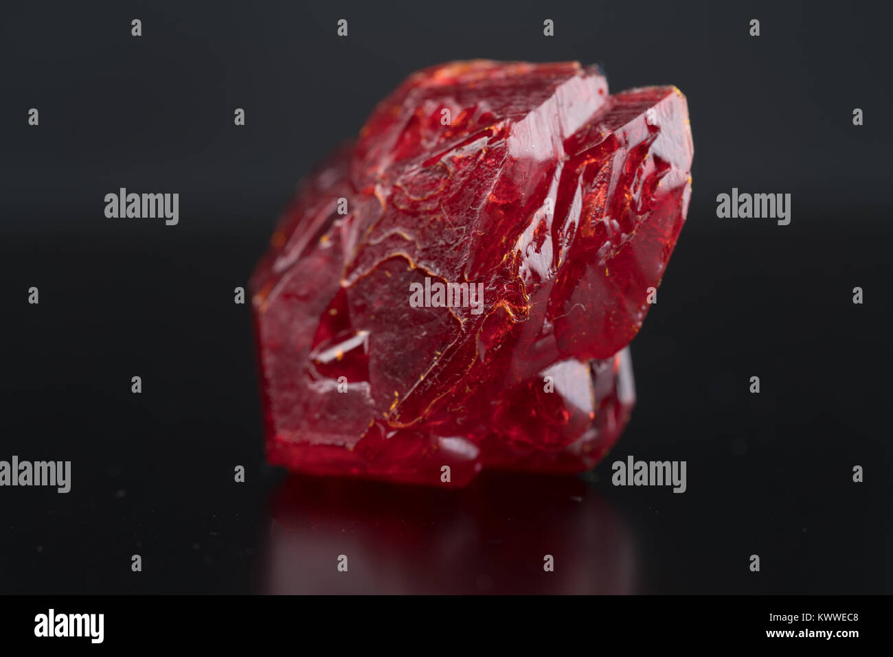 Red natural crystal mineral on a black background Stock Photo Alamy