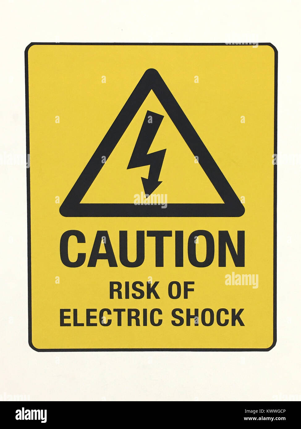 Yellow caution sign warning for risk of electric shock Stock Photo