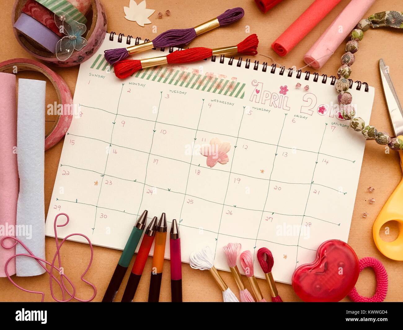 2018 April spring calendar flat lay with stationary, craft tools and materials. Stock Photo