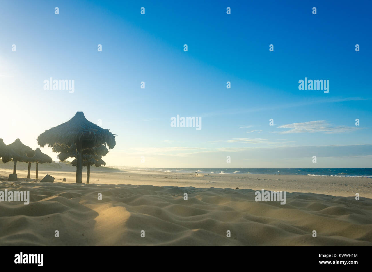 View of beach sunset with many sun umbrellas at the sand Stock Photo ...