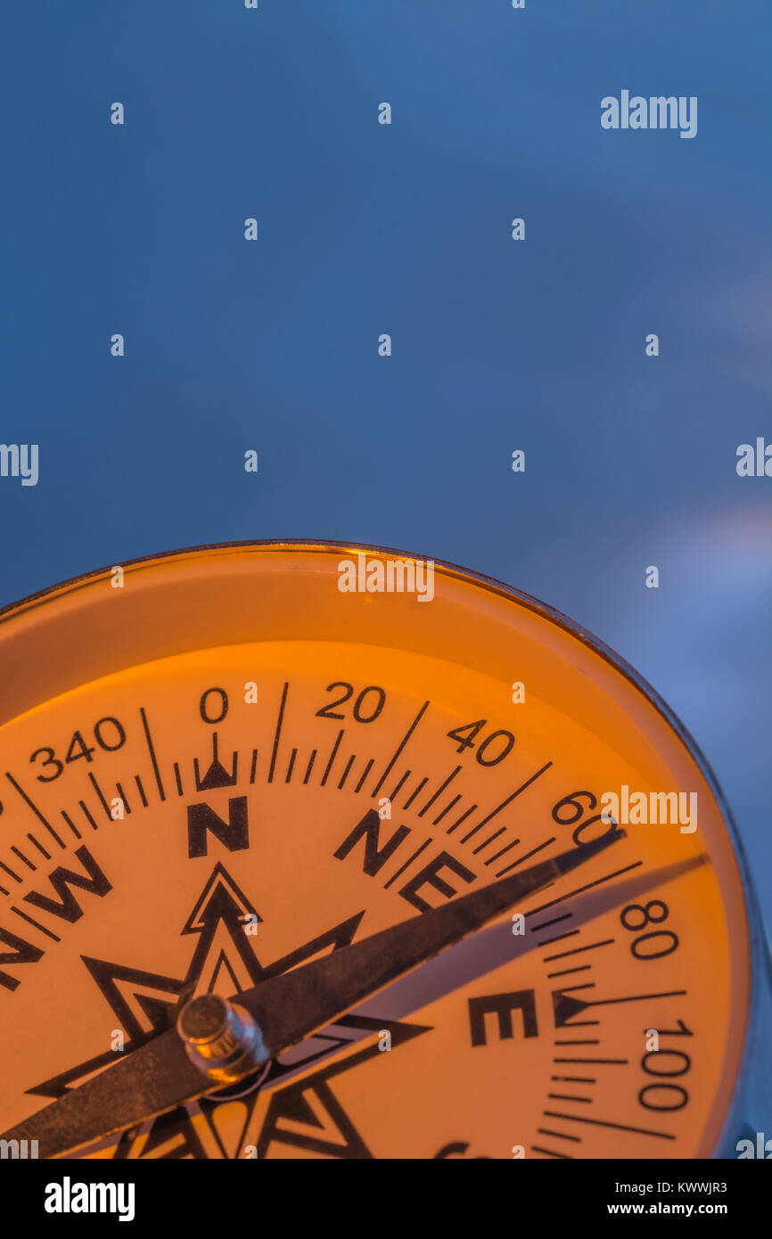 Macrophoto of compass rose face with needle with copy space. Concept