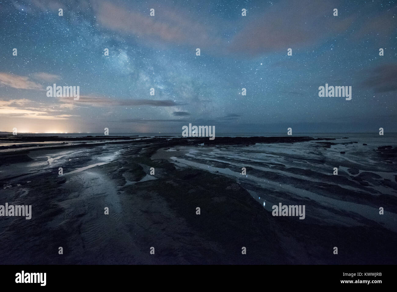 Charmouth beach under the Milky Way, near Golden Cap and Lyme Regis, on the Dorset Jurassic Coast Stock Photo