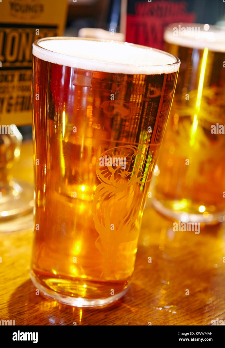 Pints of beer on table in London Pub Stock Photo