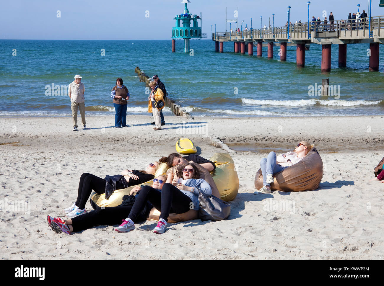 People relaxiing at the beach, pier of Zingst, Fishland, Mecklenburg-Western Pomerania, Baltic sea, Germany, Europe Stock Photo