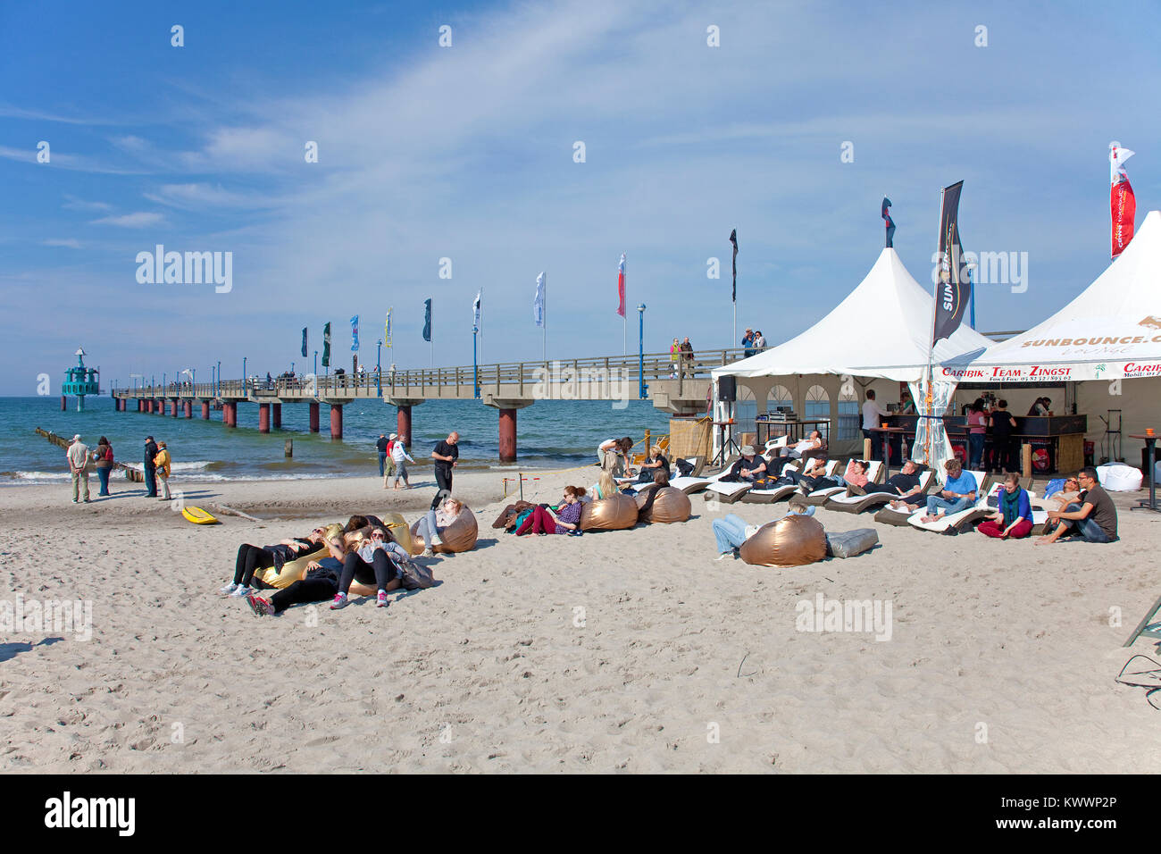 People relaxiing at the beach, pier of Zingst, Fishland, Mecklenburg-Western Pomerania, Baltic sea, Germany, Europe Stock Photo