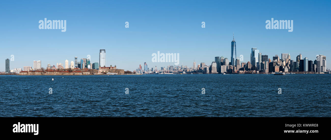 Lower Manhattan and Ellis Island panorama, view from Liberty Island, New York. Stock Photo