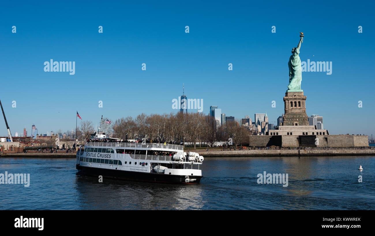 Statue of Liberty and ferry boat, Liberty Island, New York. Stock Photo