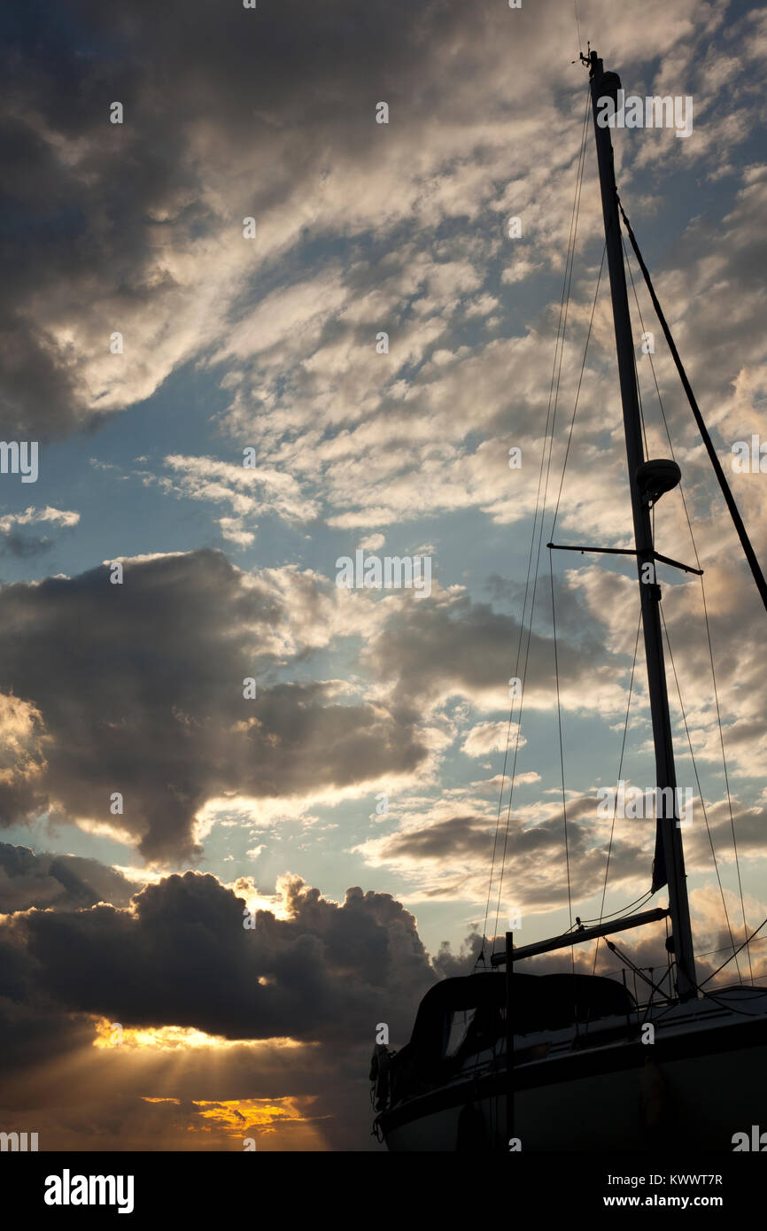 Silhouette of a sailing boat at sunset Stock Photo - Alamy