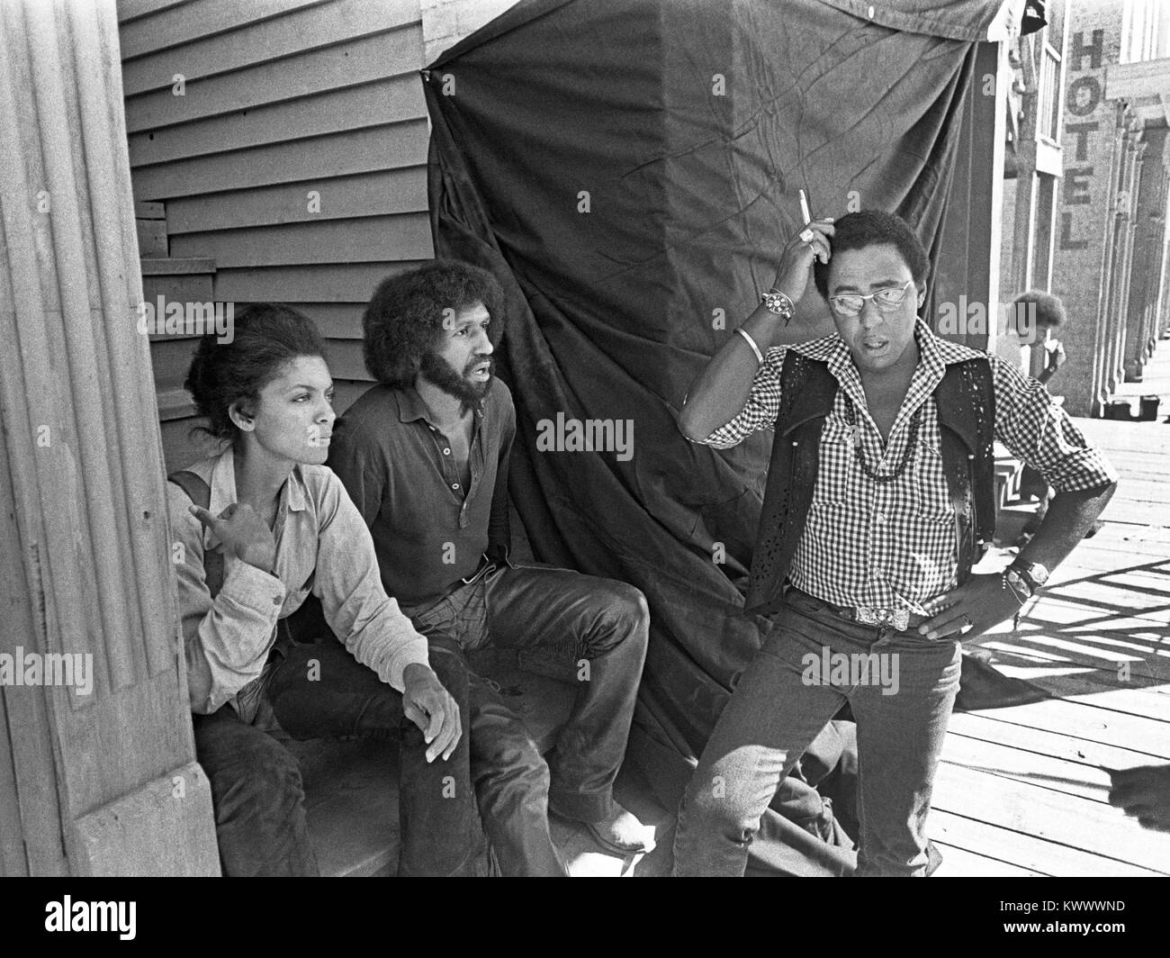 Actor Vonetta McGee (left), Max Julien (center), and director Gordon Parks Jr., on movie location in New Mexico while filming Thomasine and Bushrod, around 1973 Stock Photo