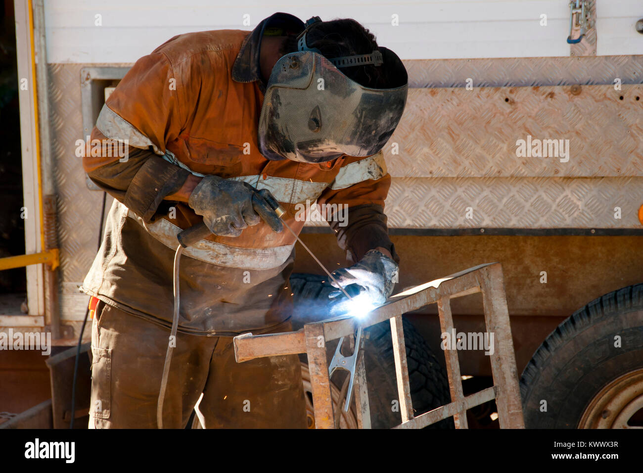 Man Welding Metal Frame Stock Photo