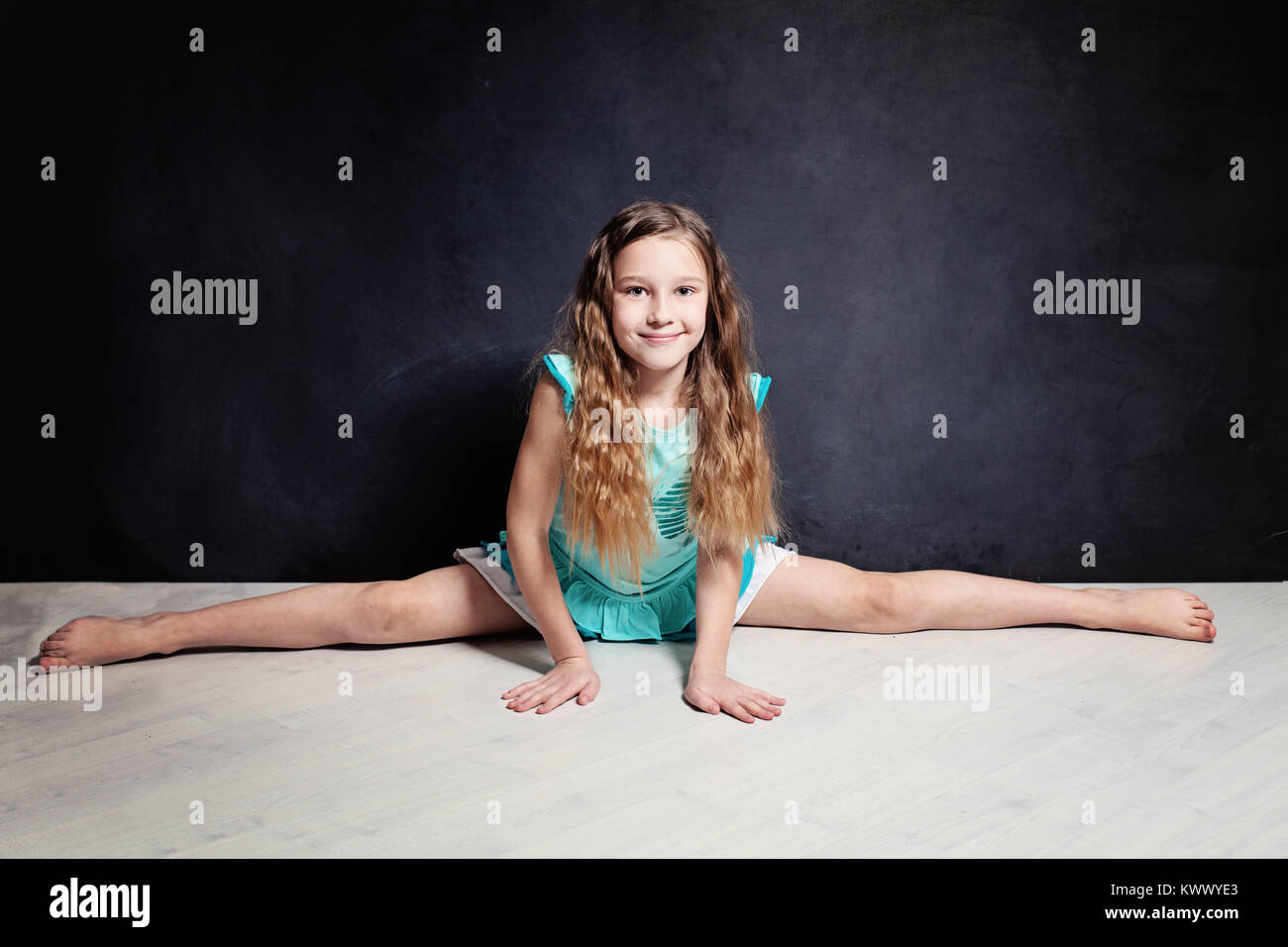 Teenager Girl Posing. Gymnastic Twine Stock Photo