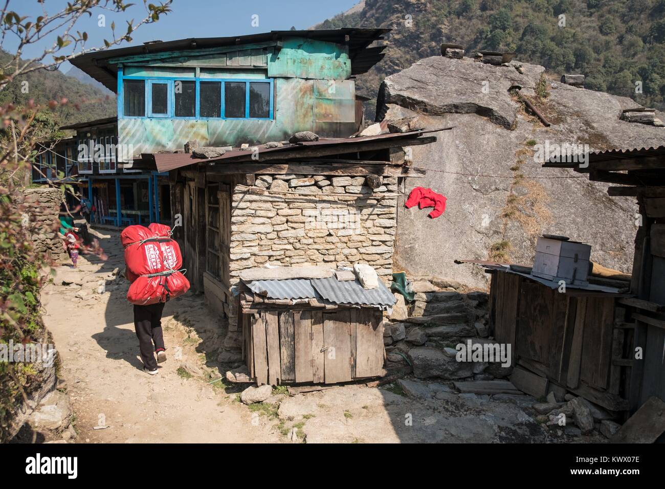 A Nepali Porta carries tourist luggage on 11.04.2017 on the trekking tour in the Annapurna
