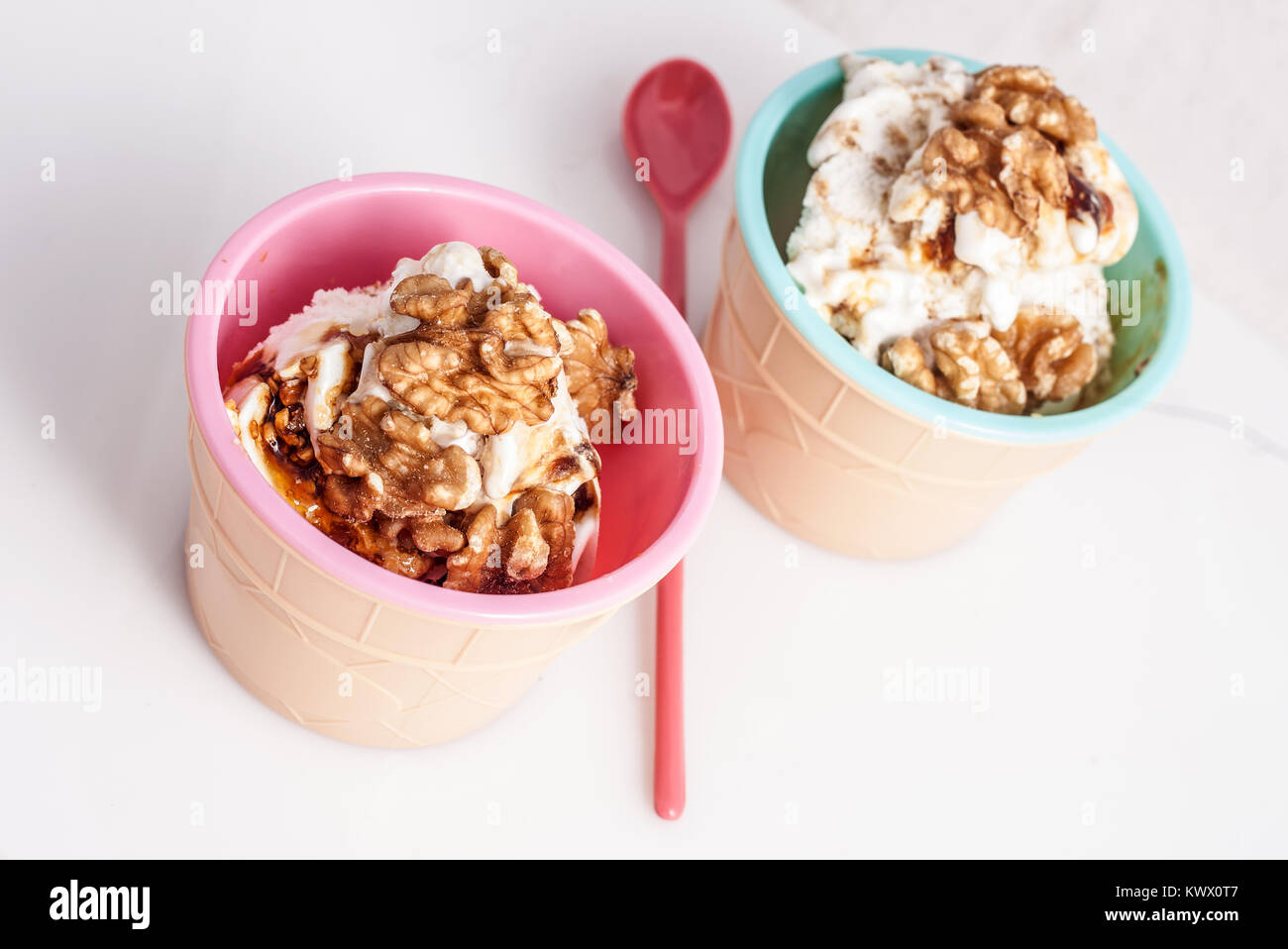 Panna cotta ice cream decorated with walnuts in a delicious plastic