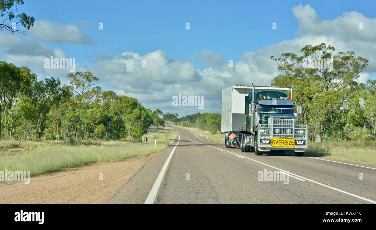 Road train on a highway, a classic australian scene, the road between ...